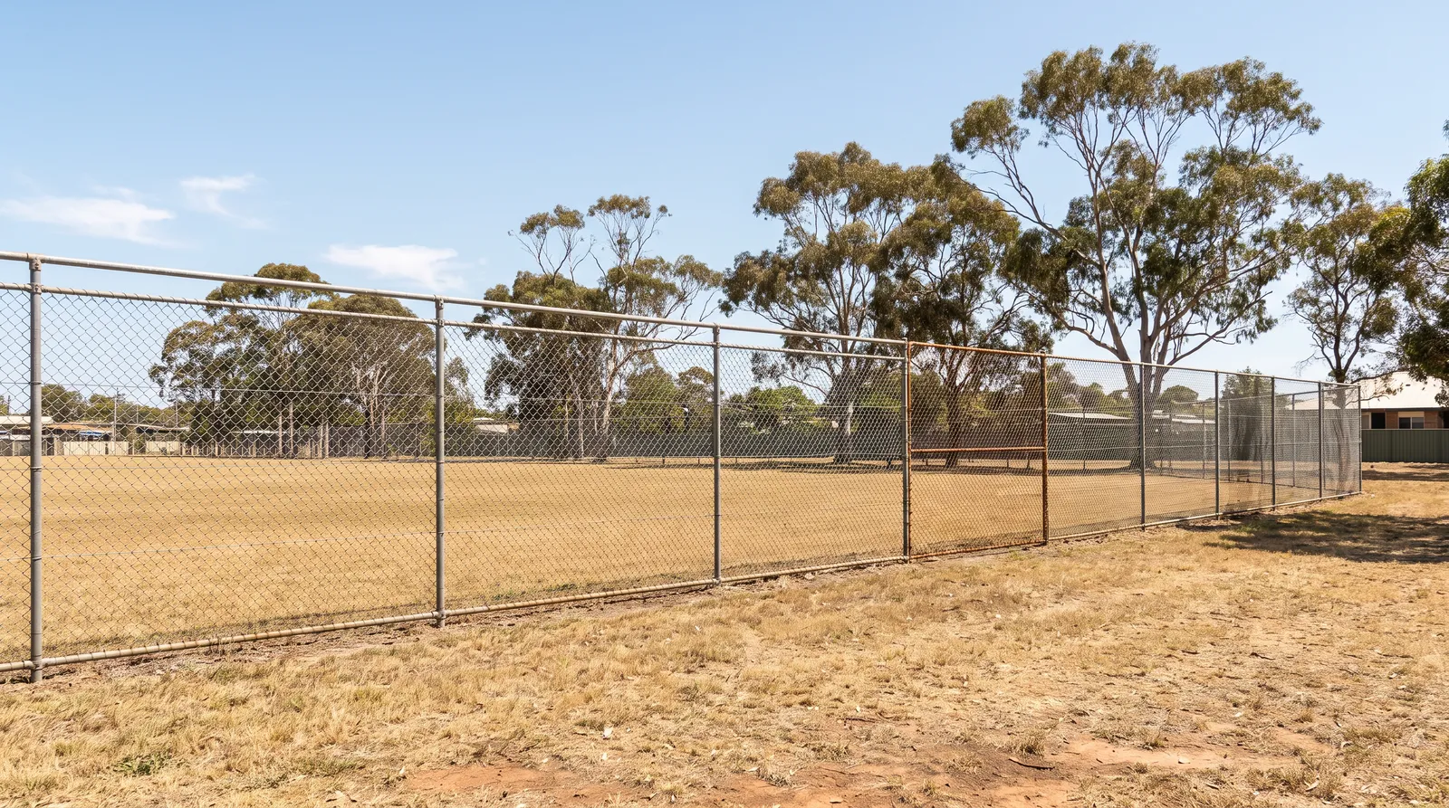Chainwire fence around a sporting field