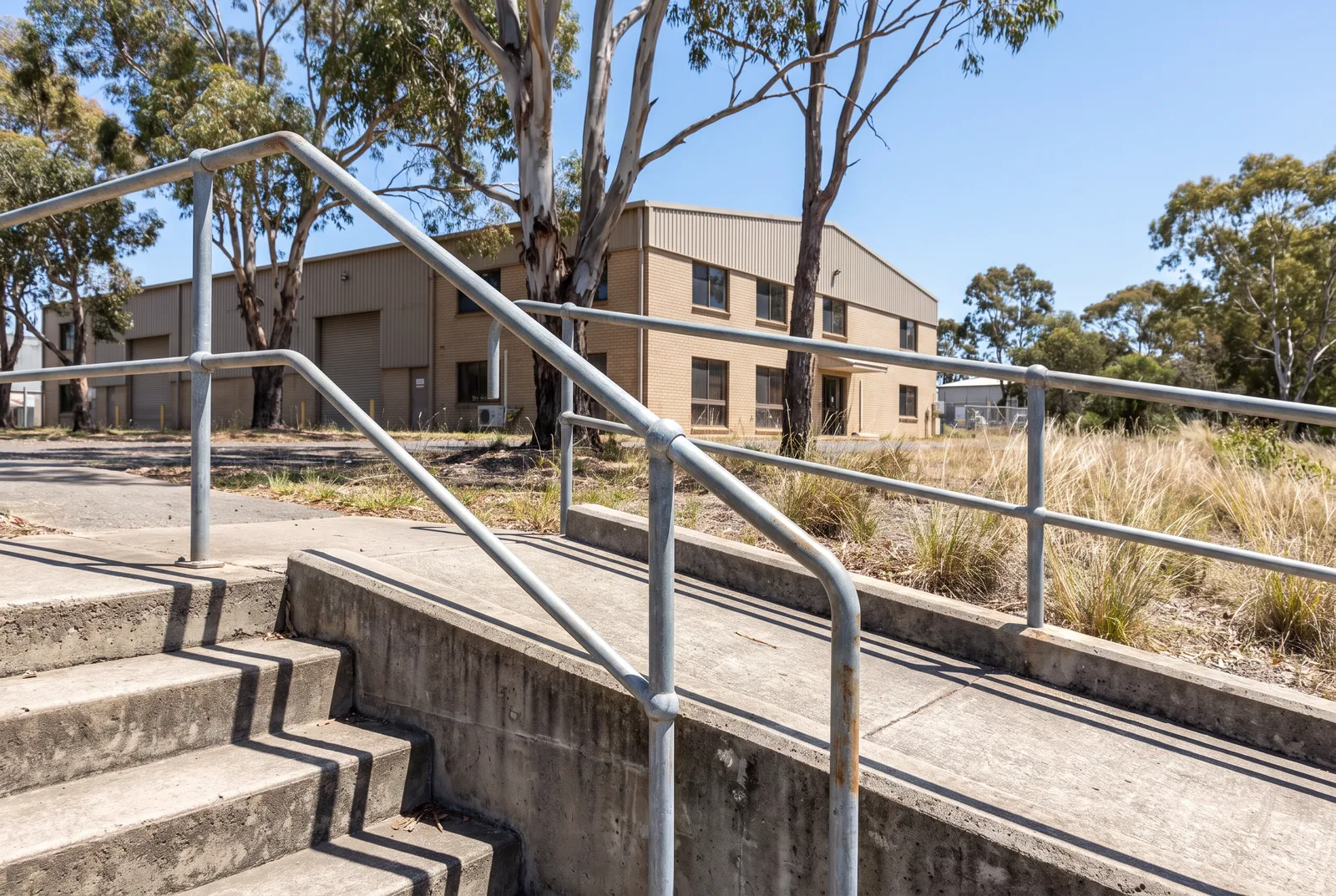 Galvanised pipe handrails on external stairs